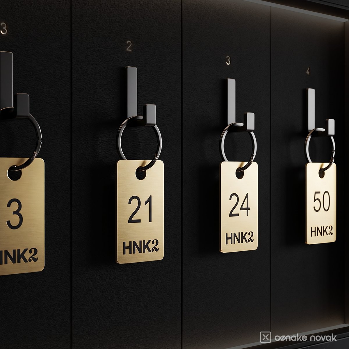 Numbered gold cloakroom tags hanging on cloakroom hooks