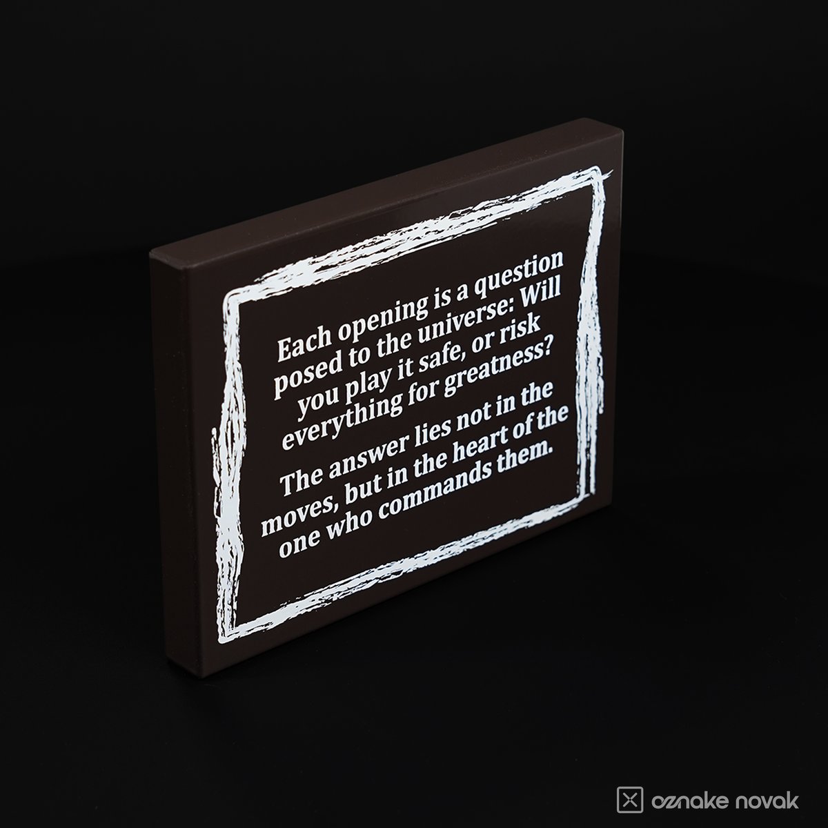 Angled view of the dark brown chess quote plate showing the bent tray edge